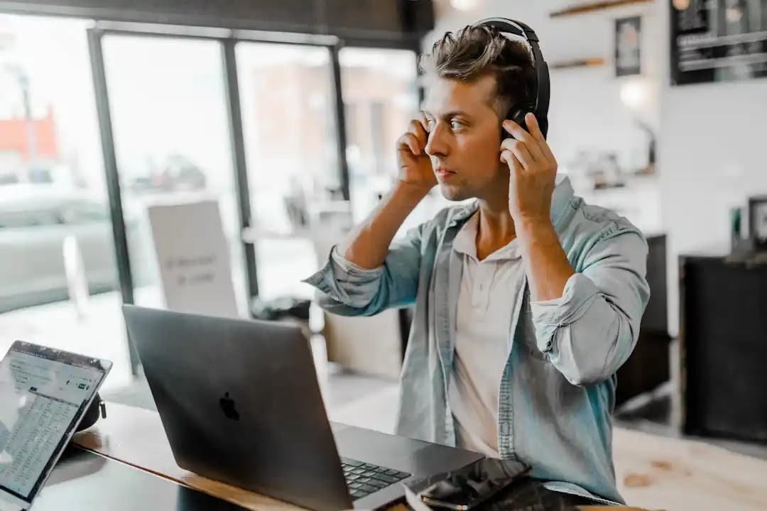 A man using Telecom Expense Management software to optimize and manage financial resources for his organization.